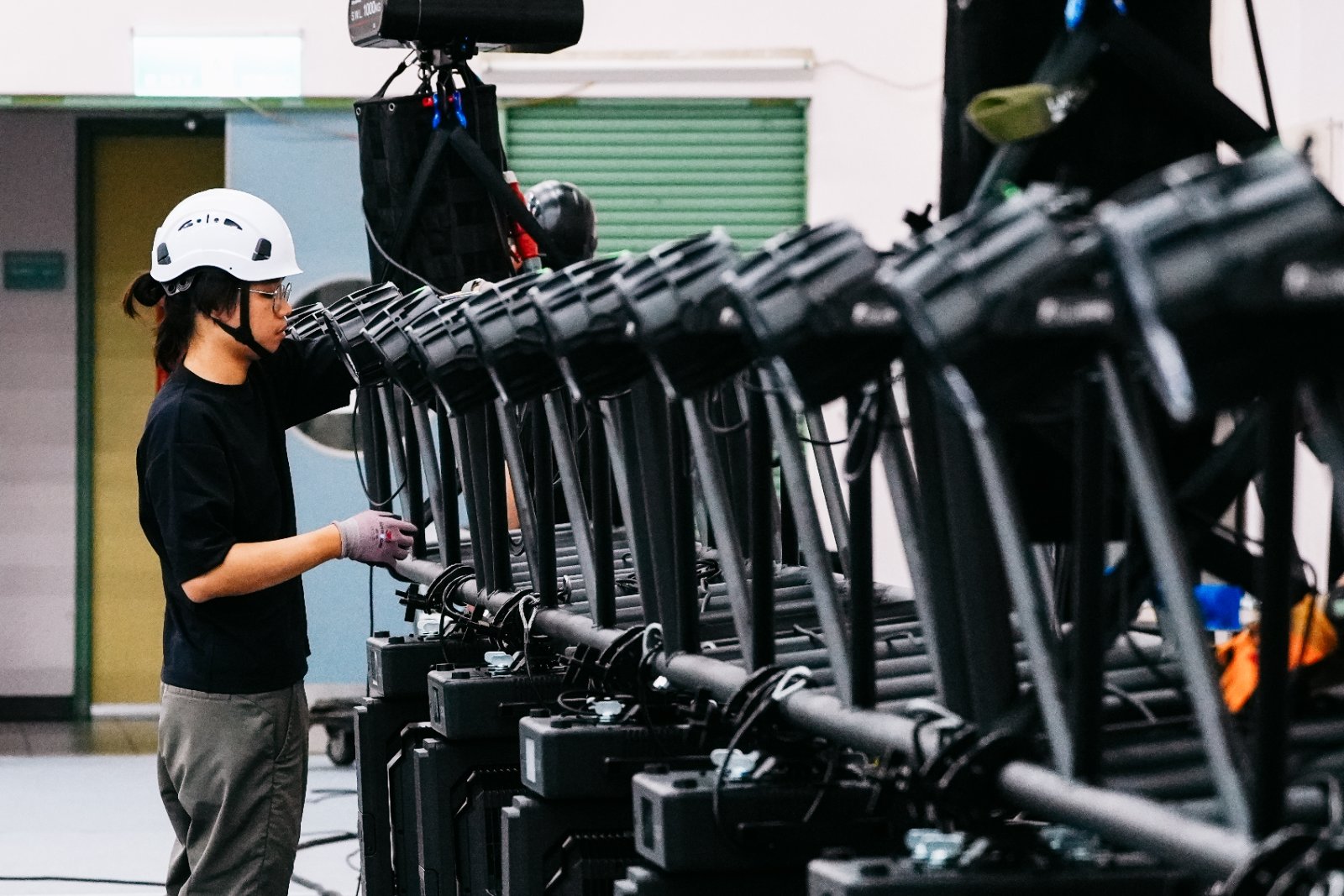 Crew rigging LumiPro fixtures